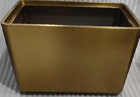 Antique brass planter box with a tapered profile