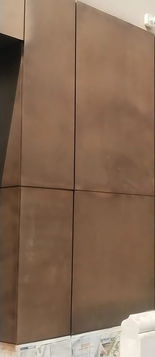 Antique brass wall cladding panels with fine shadow joints