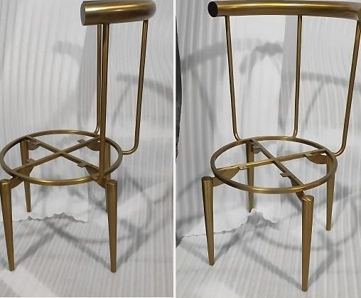 A pair of brass bar stool frames