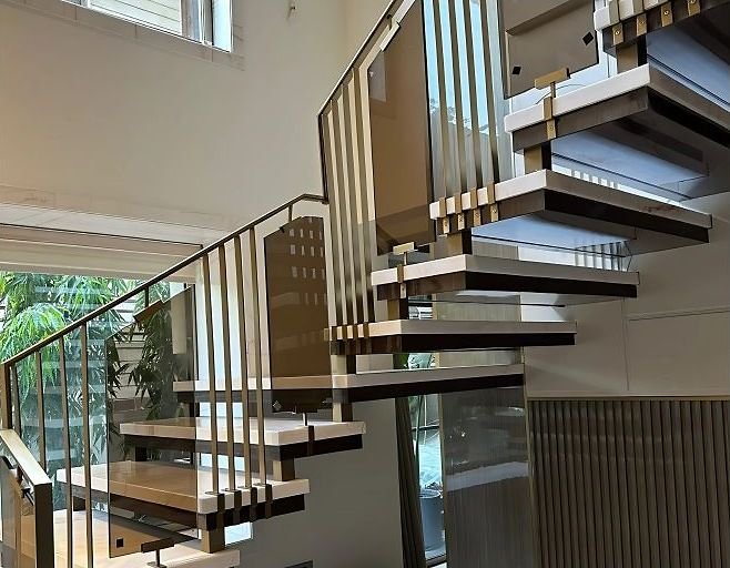 Brass detailing on cantilevered staircase treads