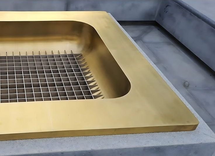 Brass fire basket set in a formed hearth tray