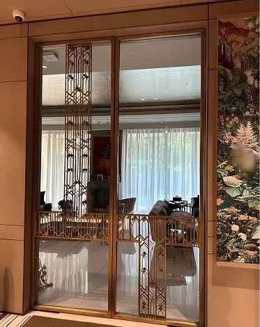 Brass-framed mirrored doors in a residence