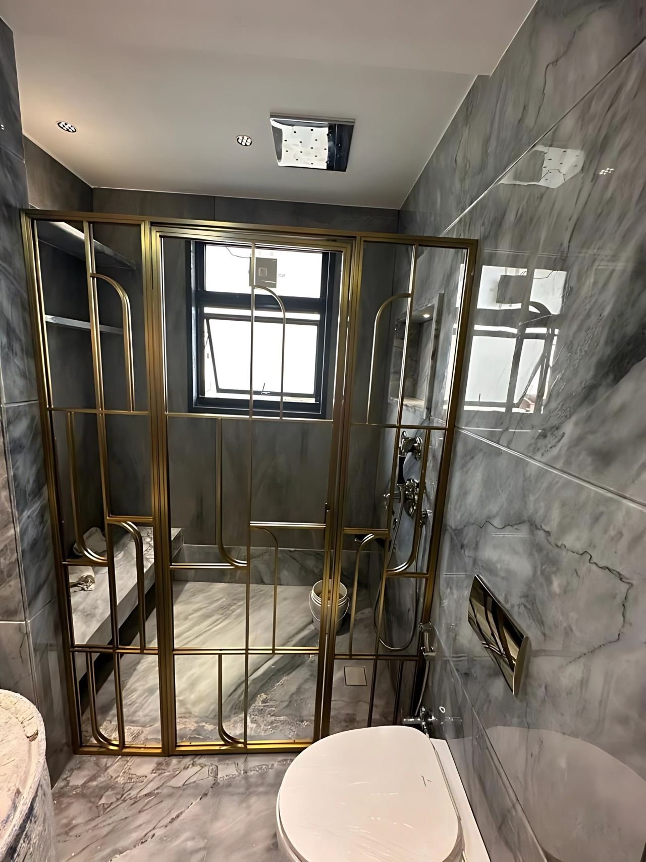 Brass-framed shower cubicle
