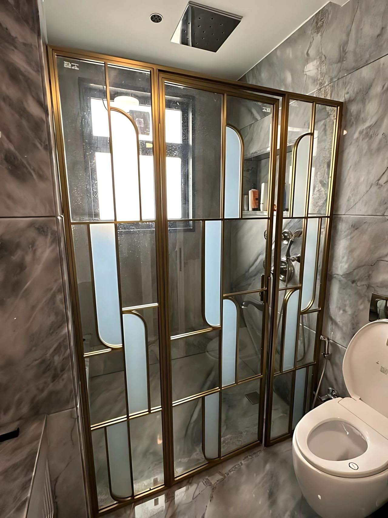 Brass-framed shower cubicle
