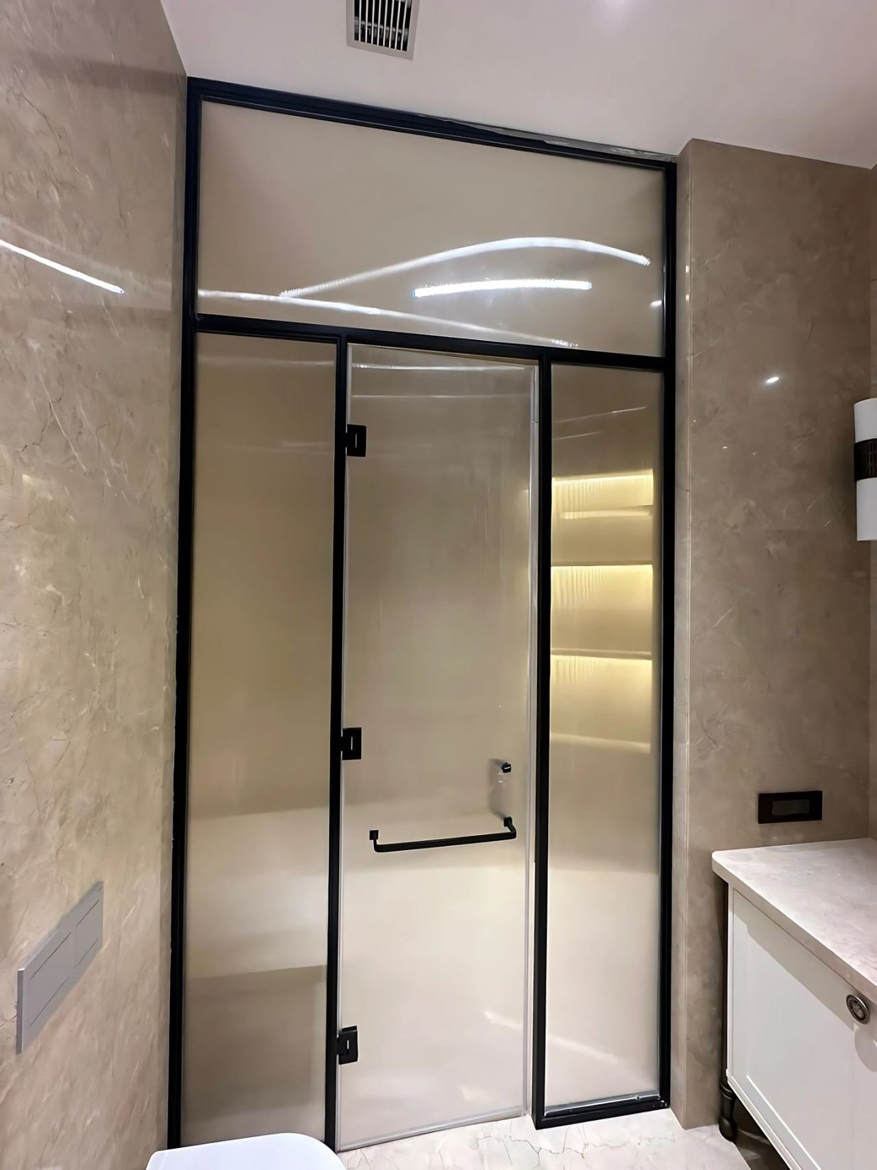Brass-framed shower cubicle