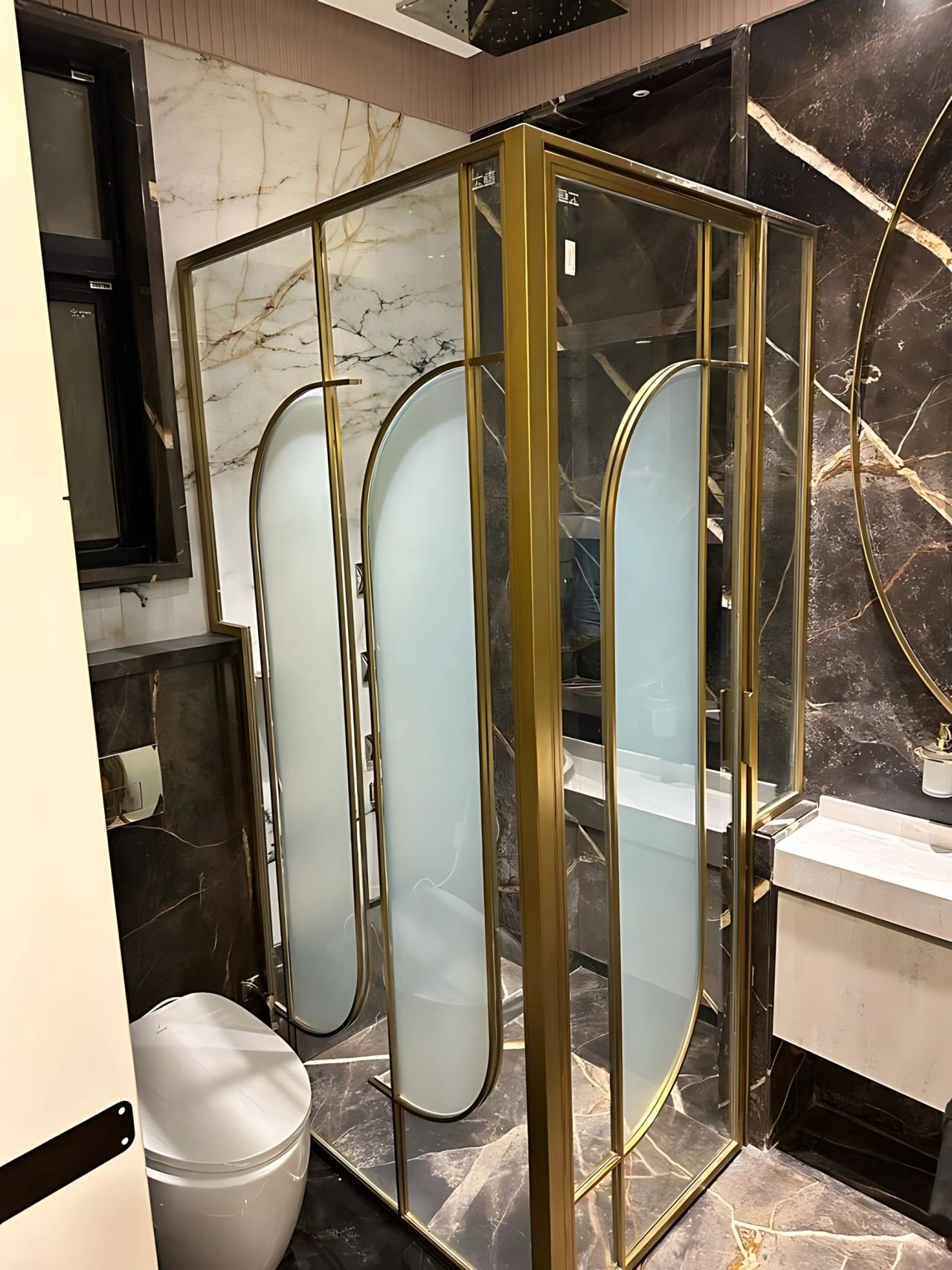 Brass-framed shower cubicle