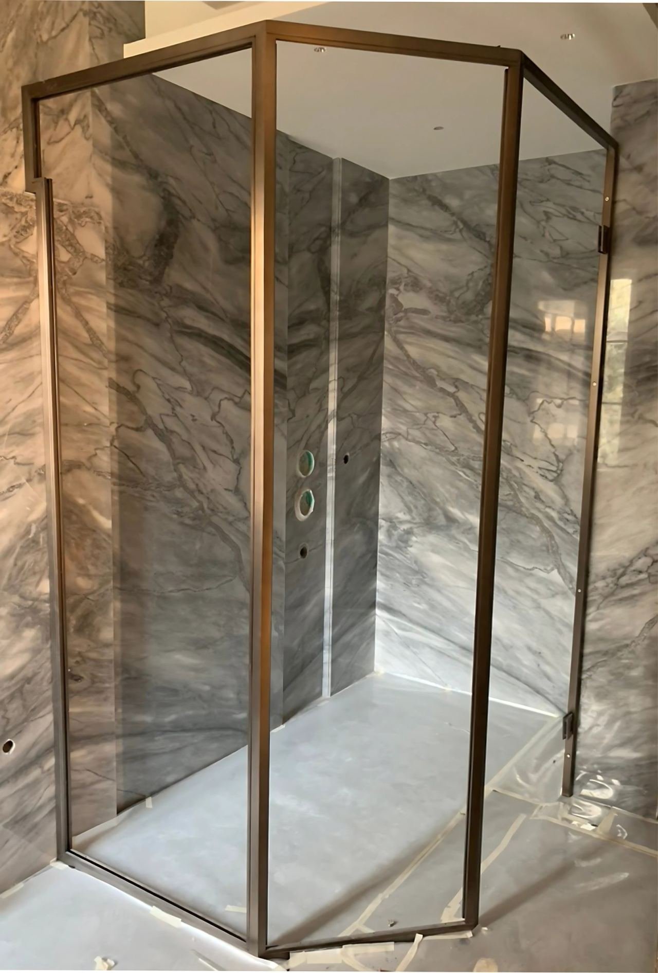 Brass-framed shower cubicle