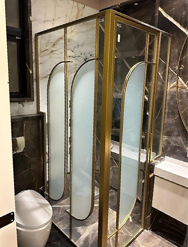 Brass and glass shower cubicle in a luxury bathroom