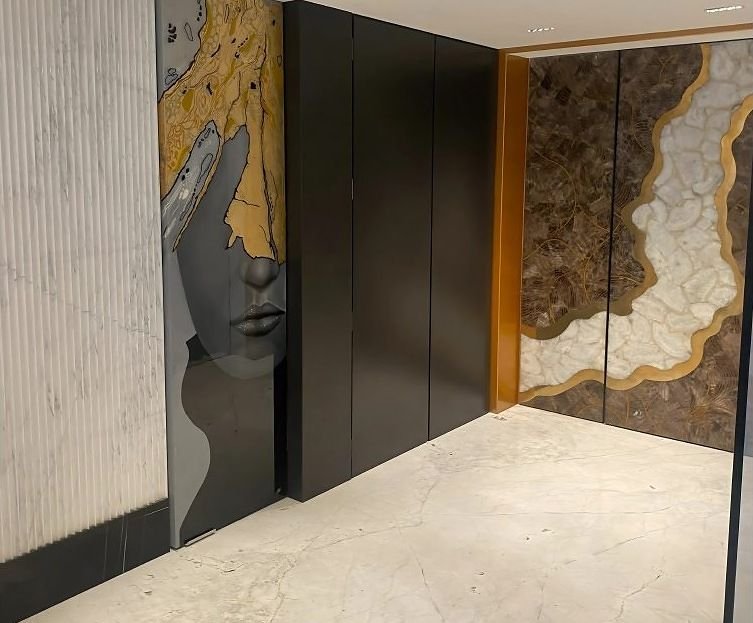 Brass inlay wall panelling along a corridor