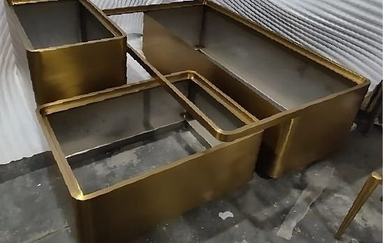 Brass table frames assembled on the fabrication floor