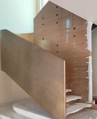 Bronze-clad staircase spine during fabrication