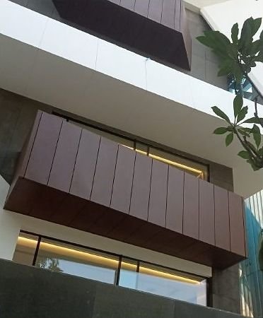 Bronze cladding and soffit detail on a building exterior
