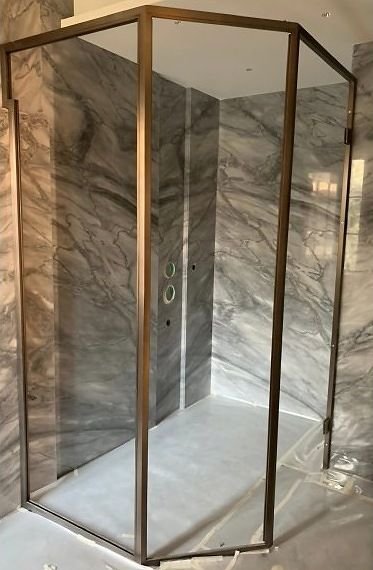 Bronze-framed corner shower enclosure