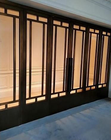 Bronze-framed glazed sliding doors