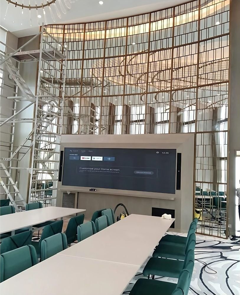 Bronze grid partition wall in a boardroom