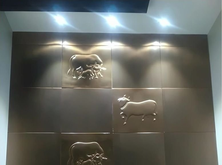Bronze wall panels with cast animal motifs