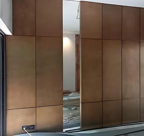 Bronze wall cladding panels in an interior