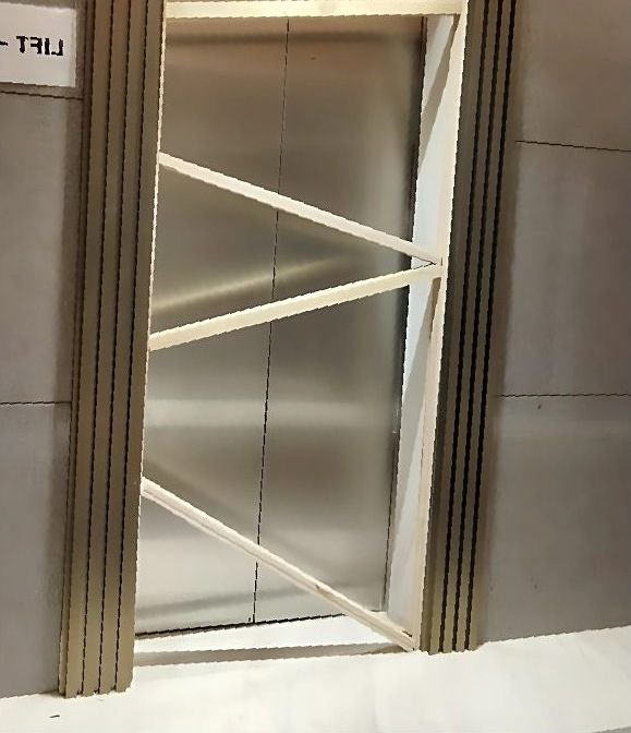 Brushed metal lift cladding detail