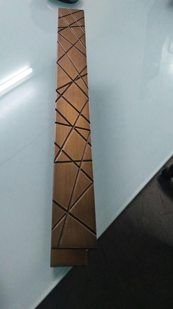Cast and embossed metal sample