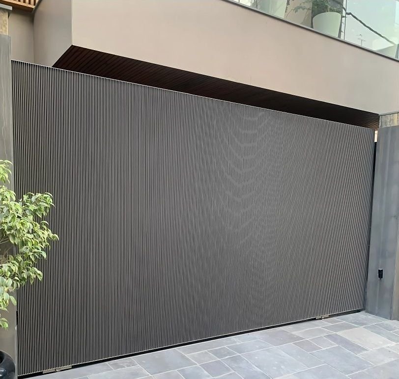 Corrugated metal sliding gate at a residence