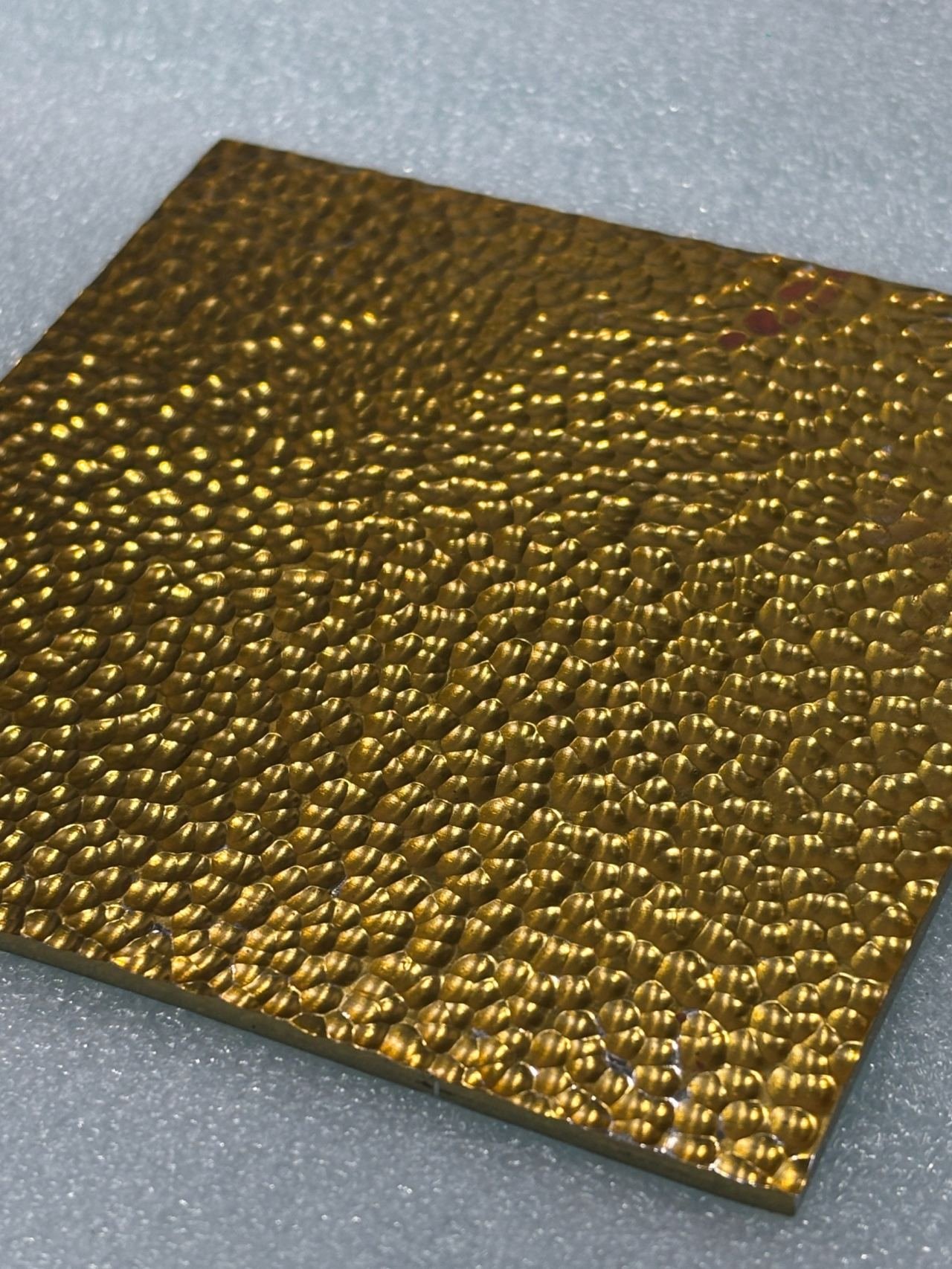 Embossed metal finish sample