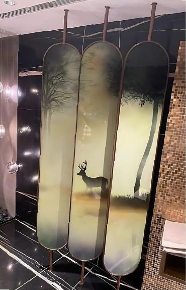 Etched metal wall panels in a dark bathroom