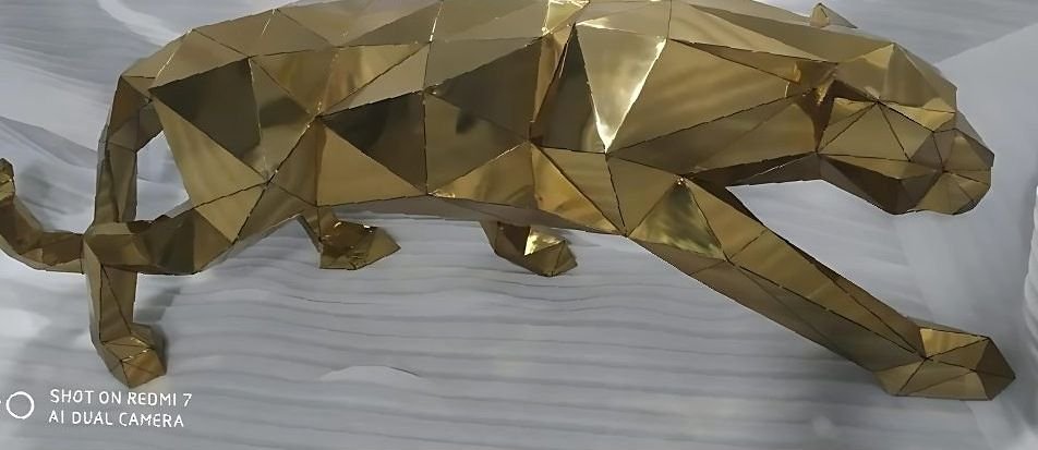 Faceted brass panther sculpture