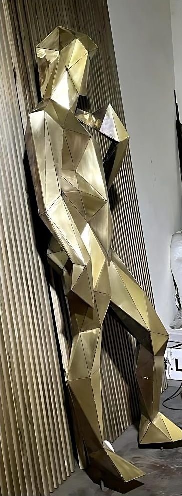 Faceted brass wall sculpture panel