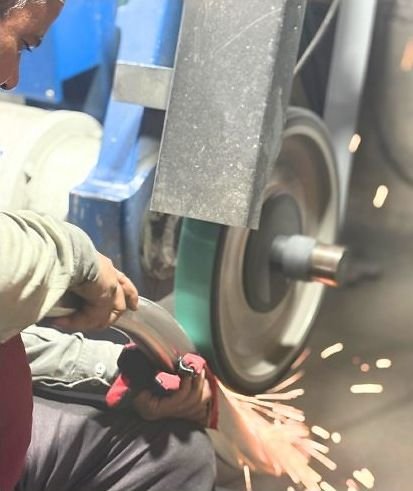 Sparks from grinding during metal finishing