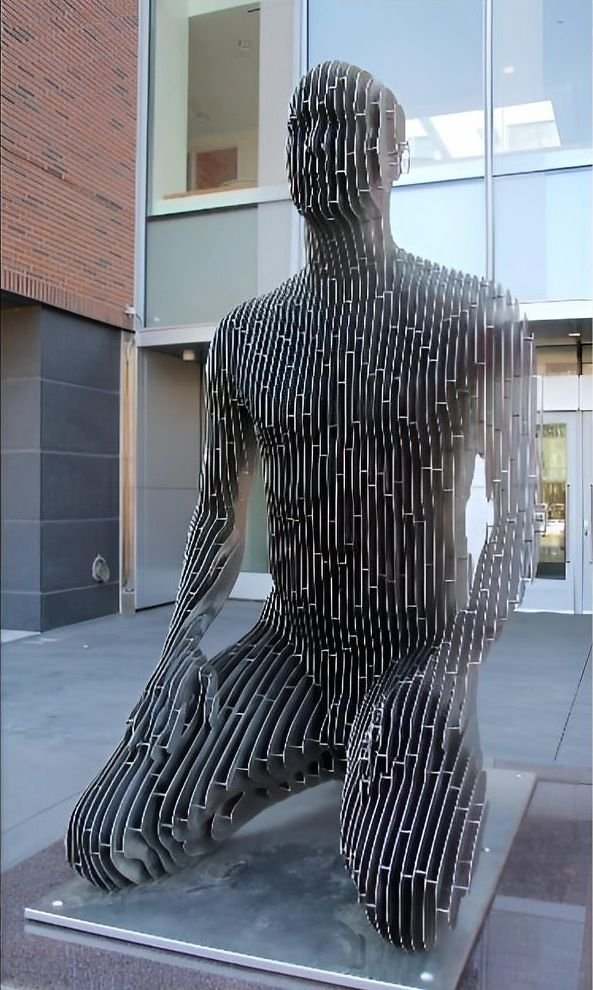 Laser-cut steel figurative sculpture in a courtyard