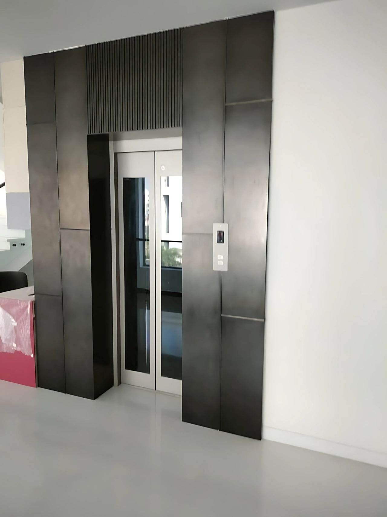 Lift door cladding and lobby panelling
