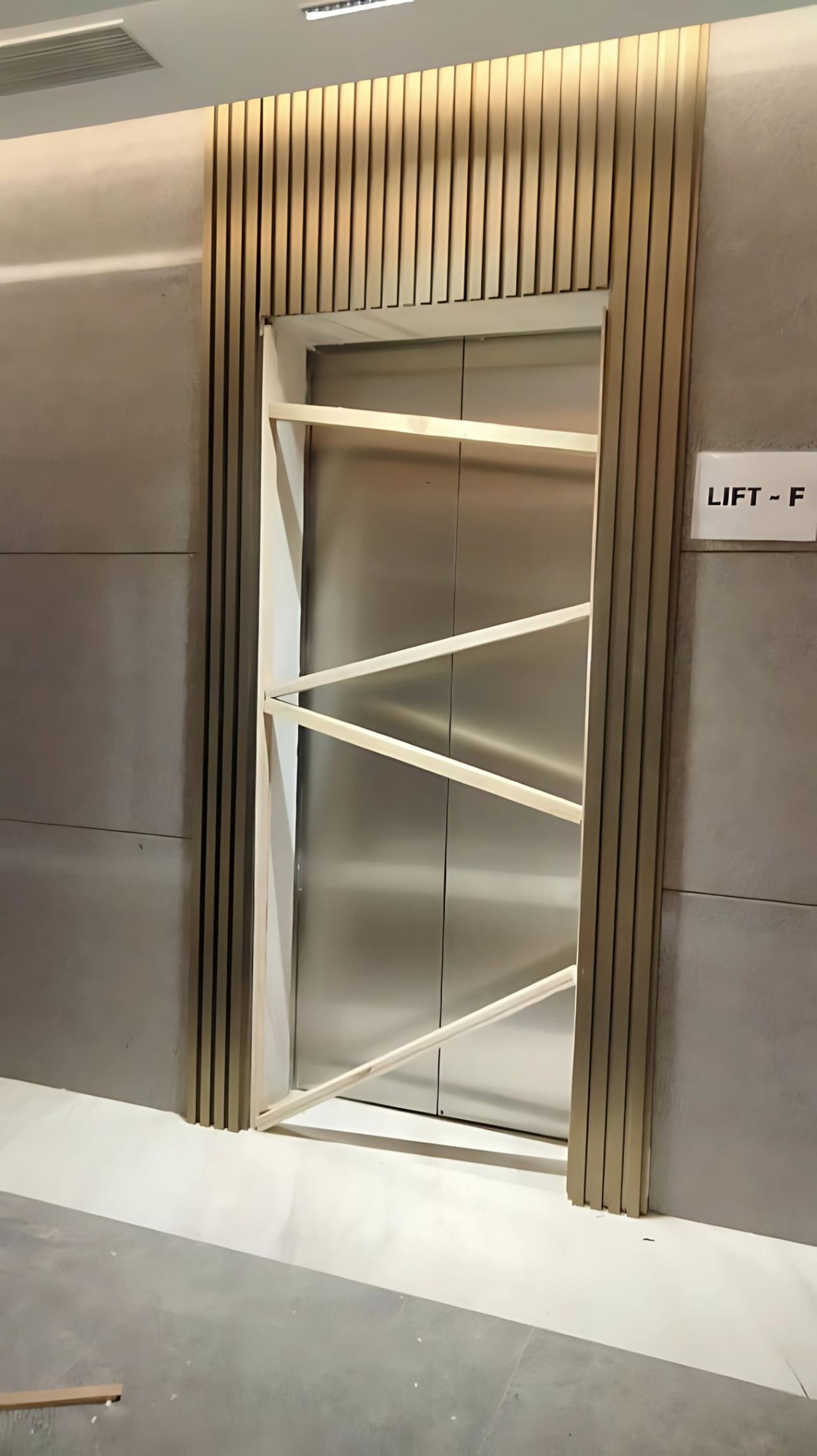 Lift door cladding and lobby panelling