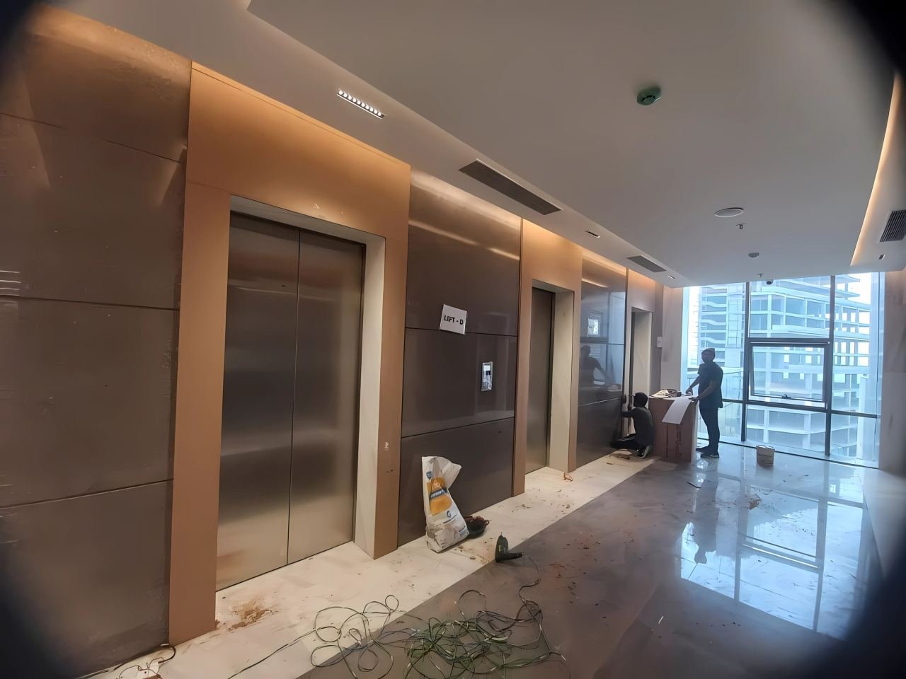 Lift door cladding and lobby panelling