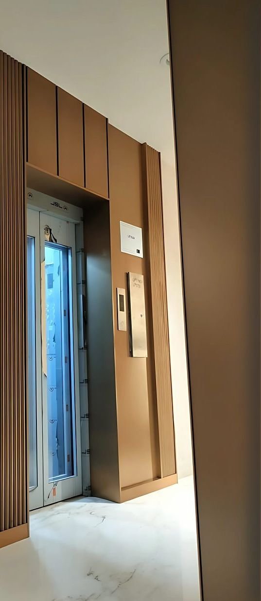 Metal-clad lift doors and lobby surround