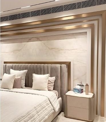 Metal headboard wall panelling in a hotel bedroom
