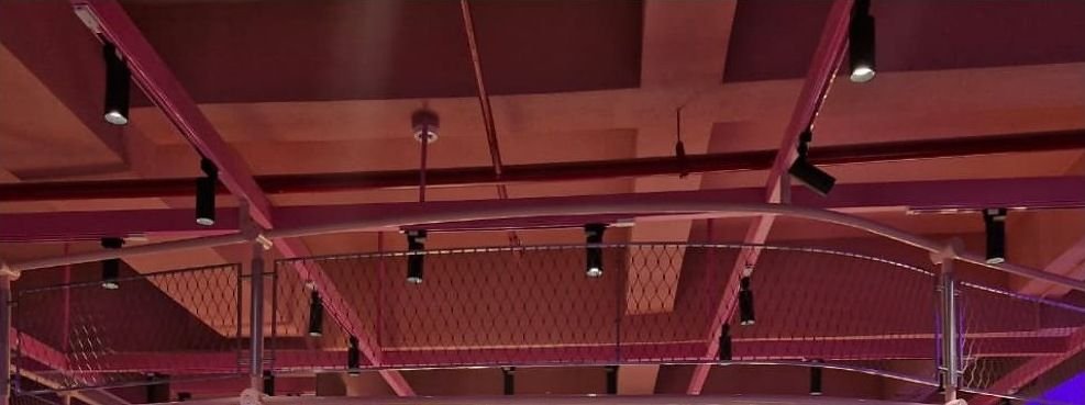 Metal mesh ceiling structure over a retail store floor