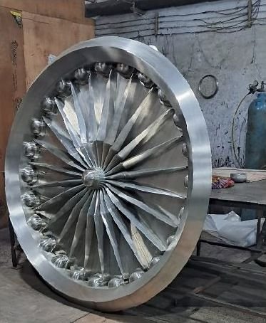 Stainless steel cast medallion in the workshop