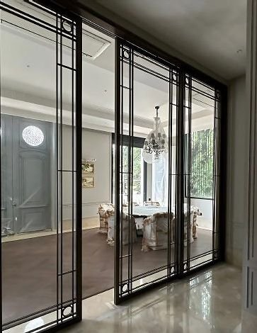 Steel and glass partition doors in a residence