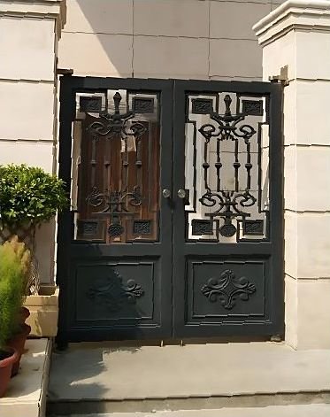 Decorative wrought metal double gate