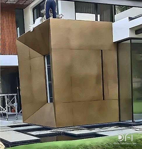 Antique brass clad architectural volume outside a residence