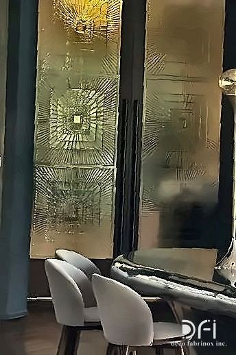 Antique brass etched wall panel beside restaurant seating