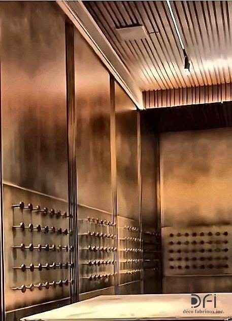 Antique brass wall cladding with studded detailing
