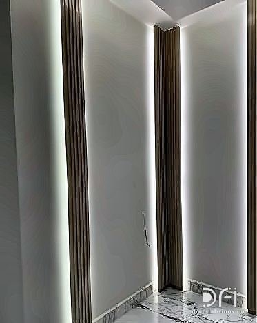 Backlit metal reveal detail in a wall