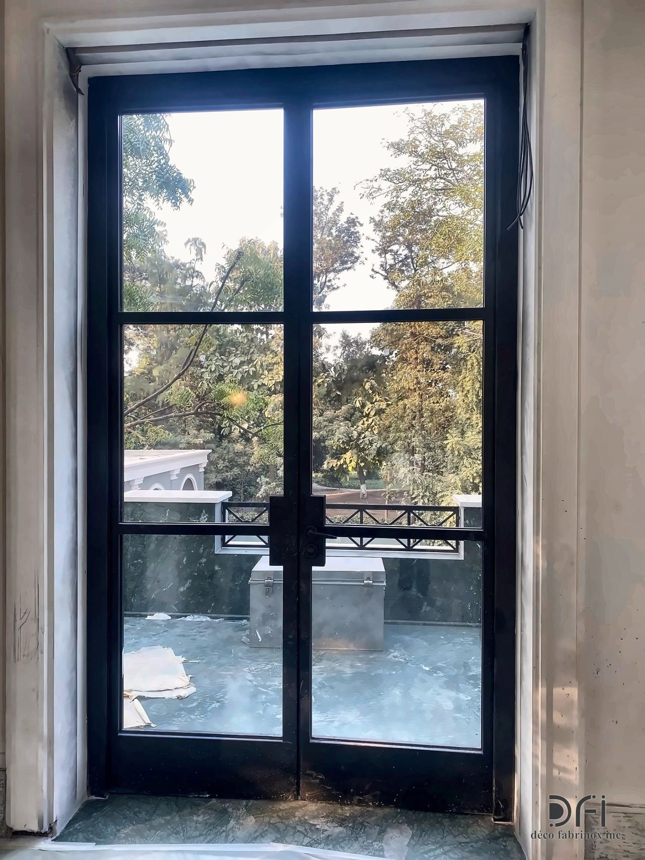 Black steel-framed double glass door