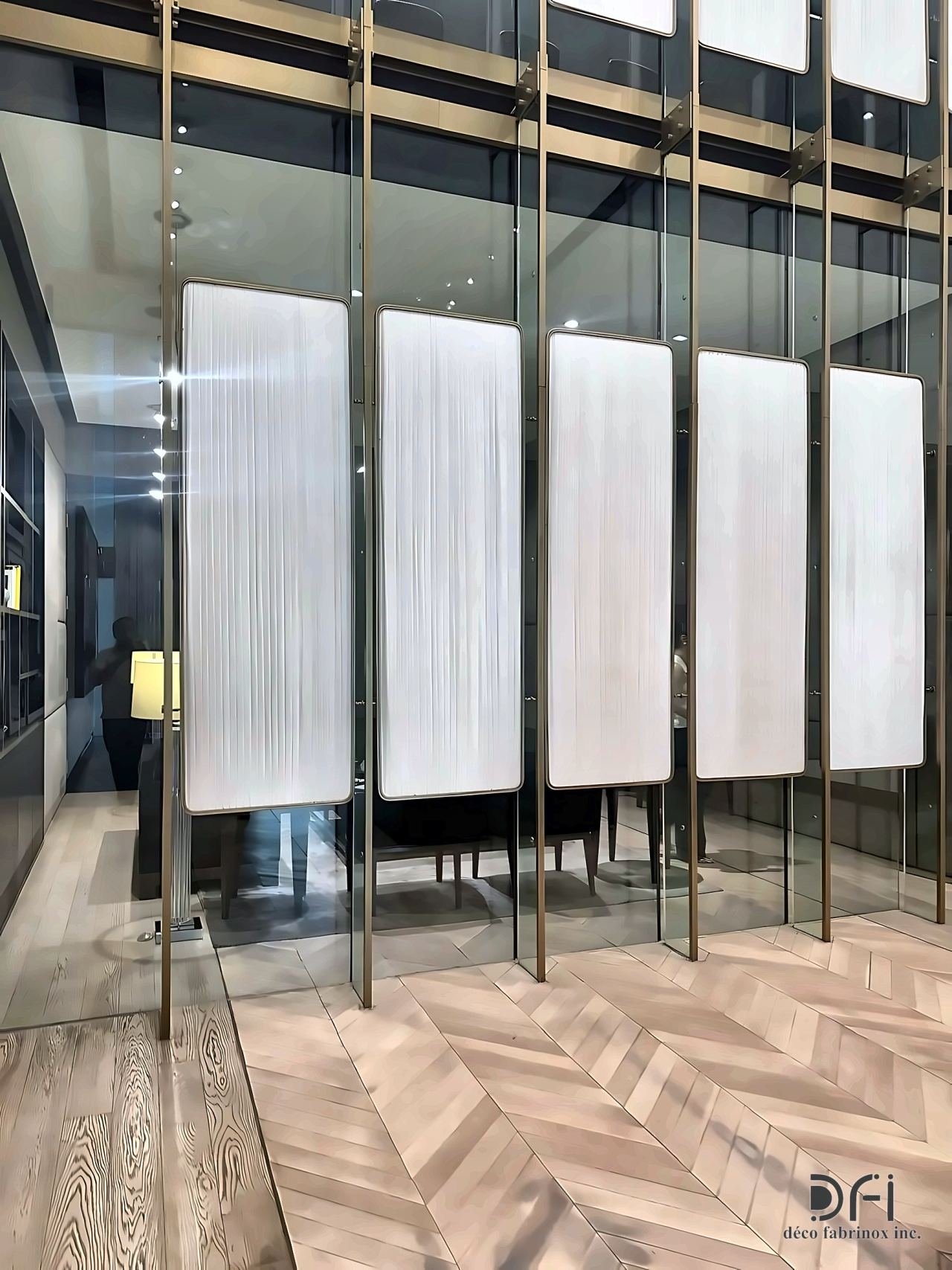 Bronze-framed glass partition with fluted panels