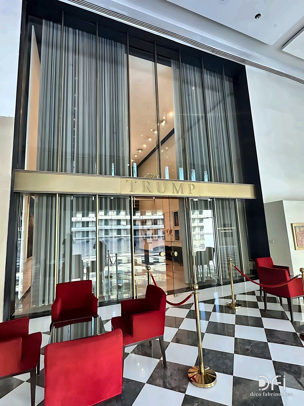 Brass entrance canopy above a glazed lobby