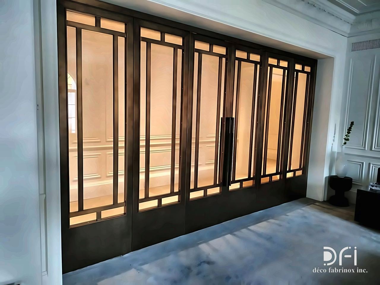 Bronze grid-framed glazed folding doors