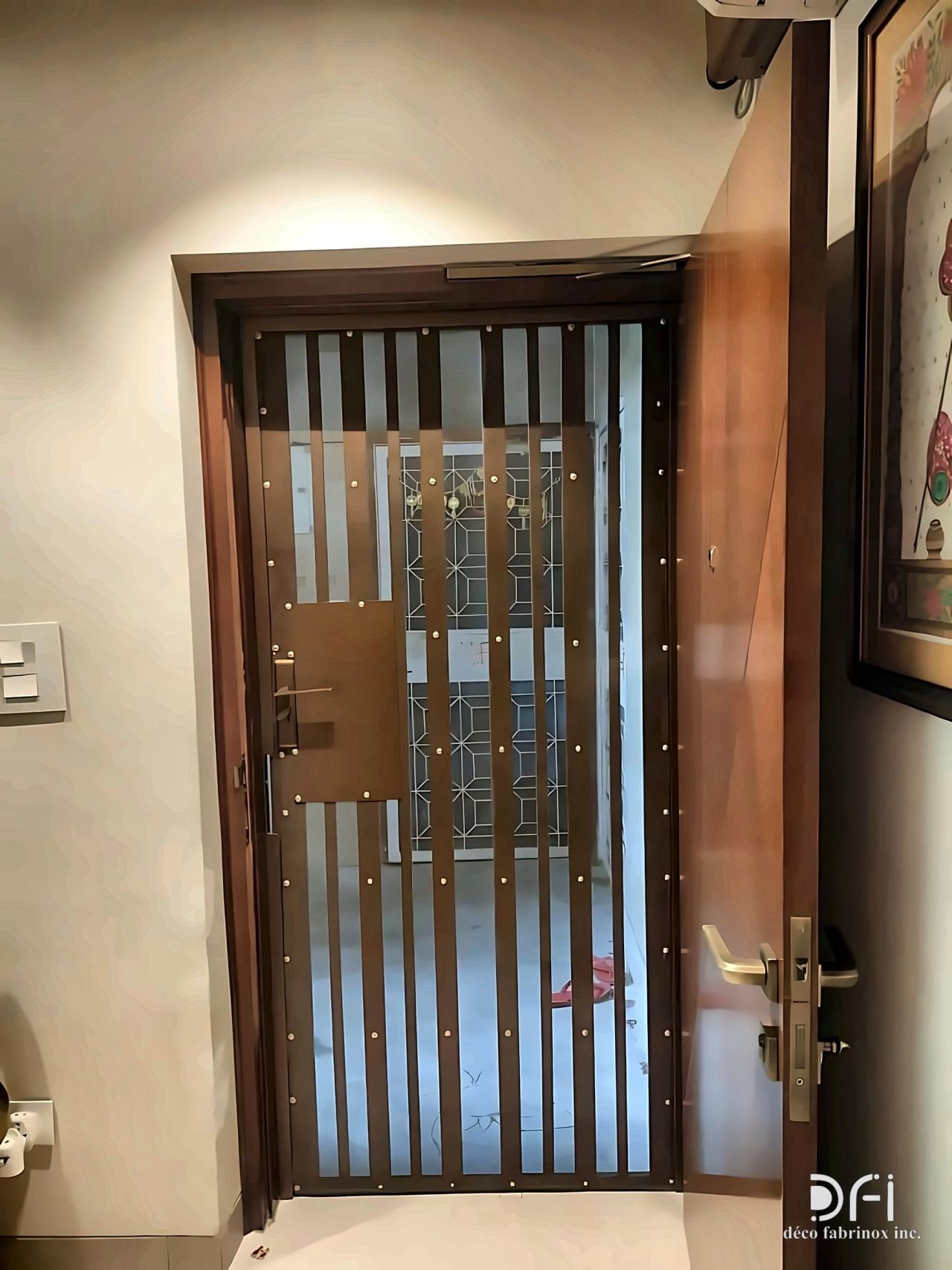 Slatted metal security door with brass hardware