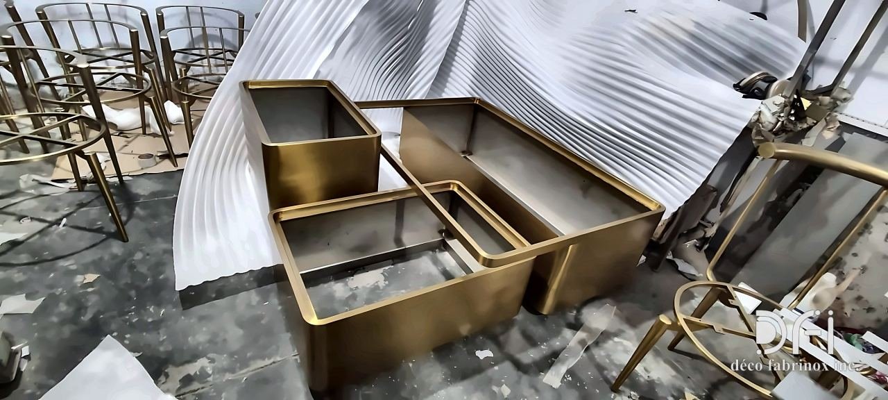 Brass planter boxes and chair frames in the workshop
