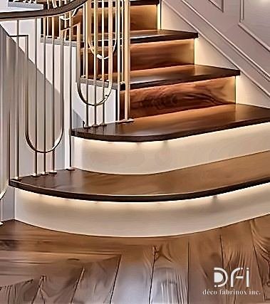 Brass balusters on a curved timber staircase